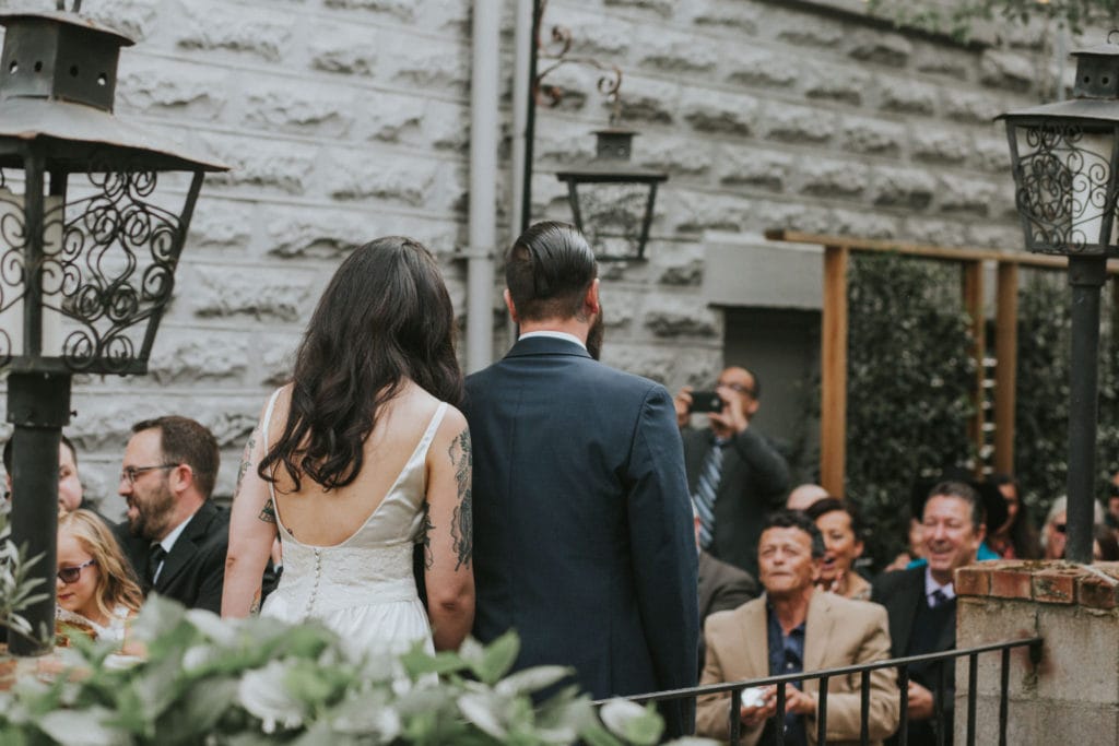 bride and groom down aisle Portland Opal 28 Wedding Photographer Marcela Pulido