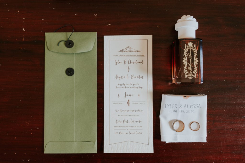 wedding invitation perfume ring details on wood Estes Park Rocky Mountain Wedding Photographer