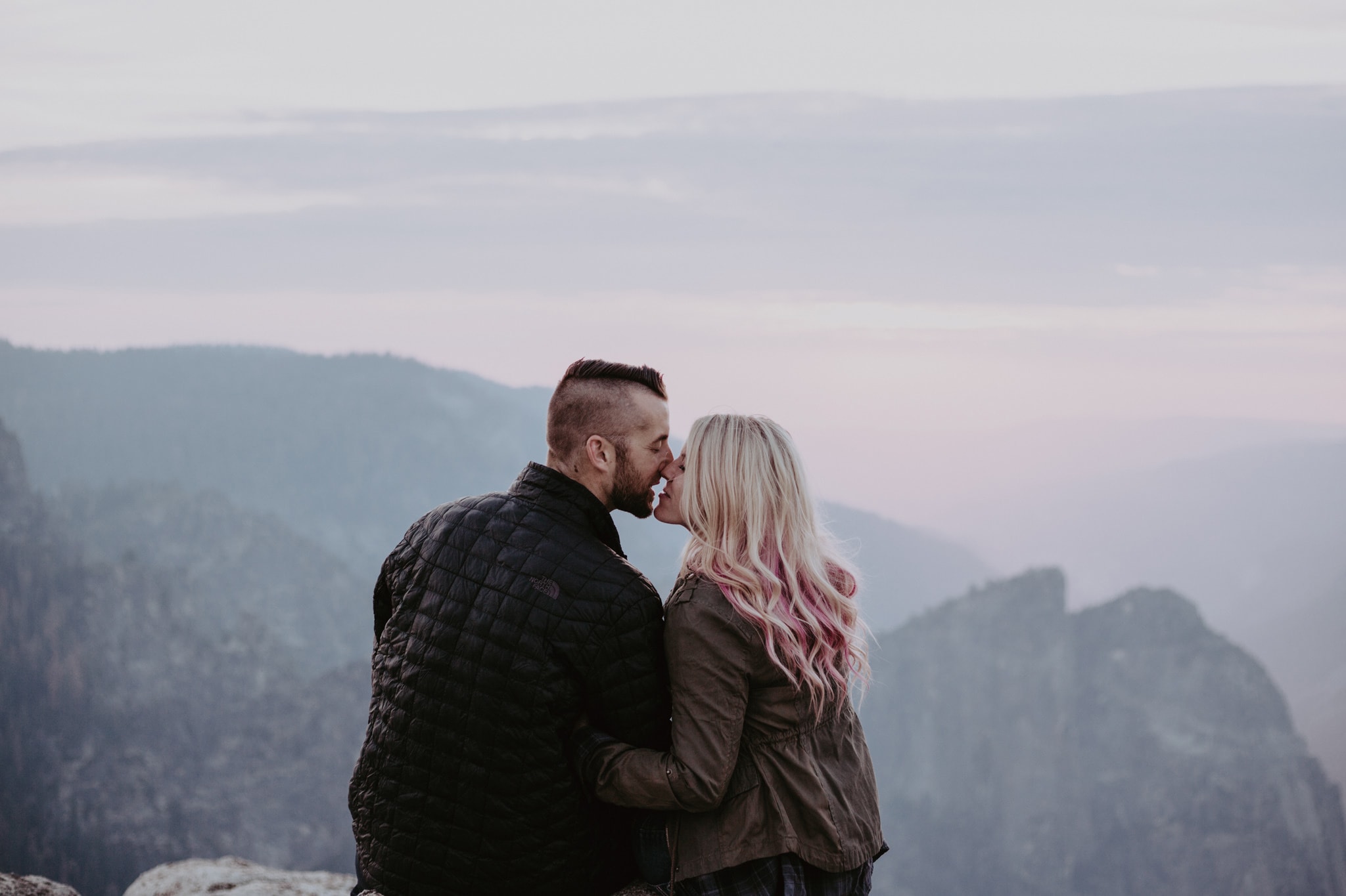 sunset at Taft Point kiss Yosemite Engagement Photographer