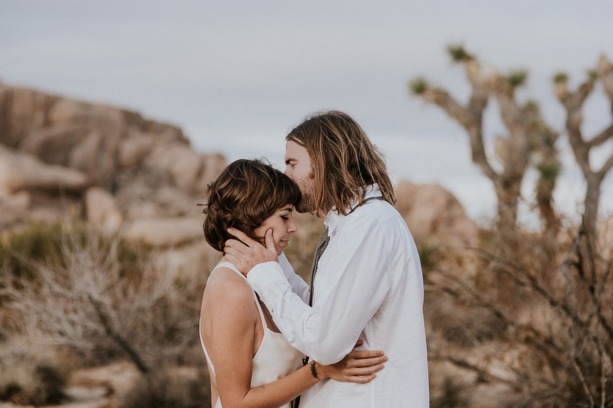 forehead kisses Joshua Tree Elopement Skull Rock Marcela Pulido Portland Wedding Photographer