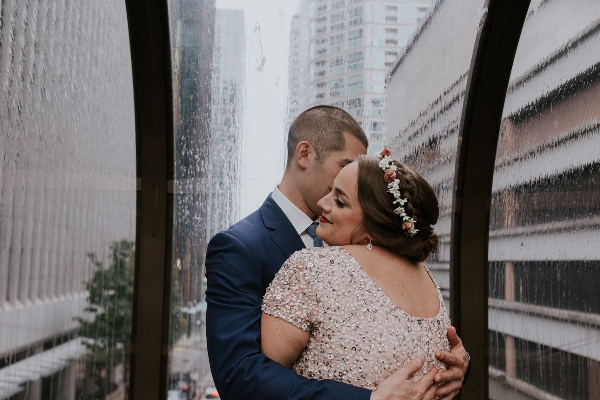 rainy embrace in sky bride Westin Seattle Kubota Garden Wedding by Marcela Pulido Photography Portland Wedding Photographer