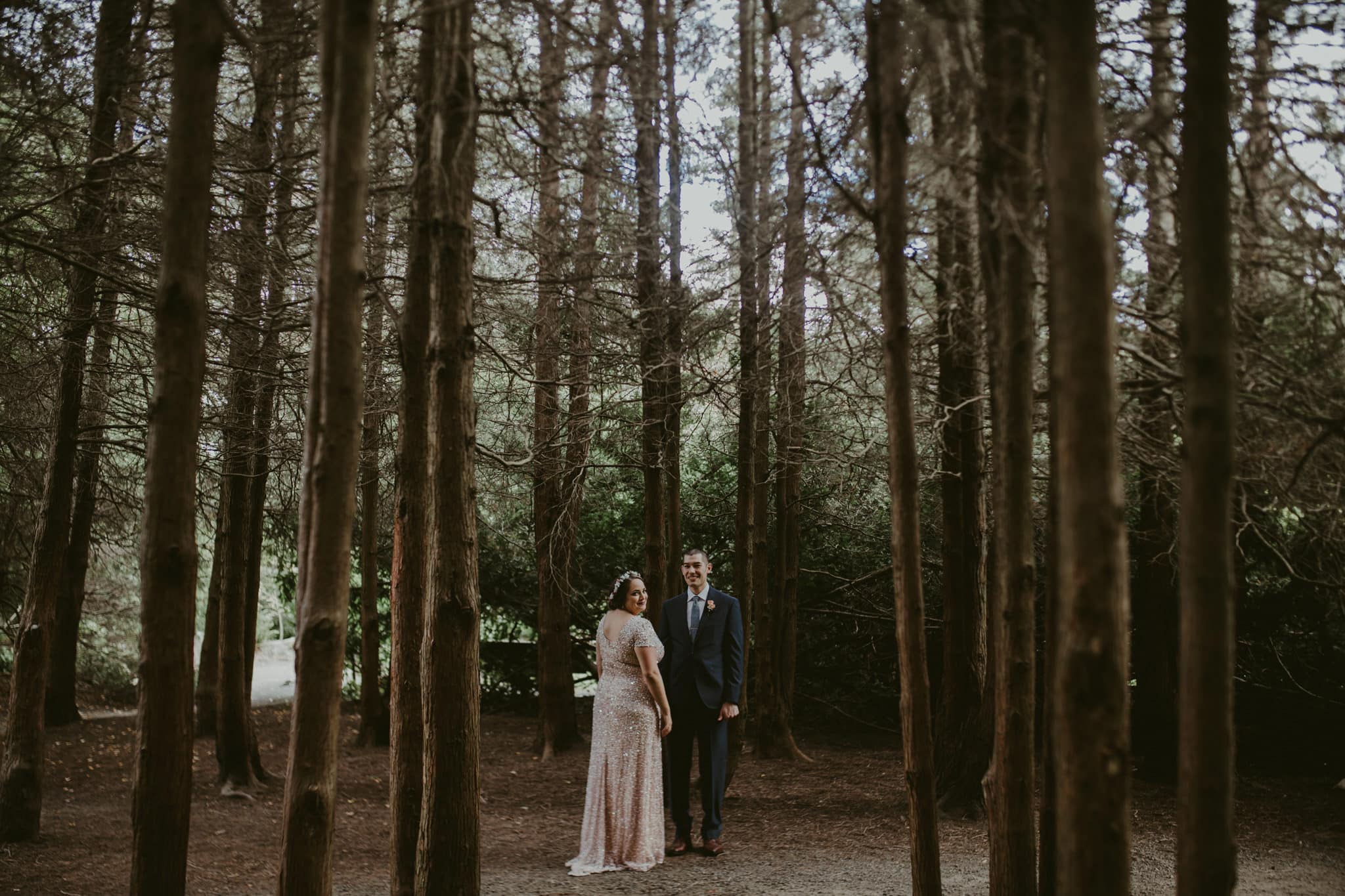 bride and groom amongst trees Kubota Garden Wedding by Marcela Pulido Photography Portland Wedding Photographer