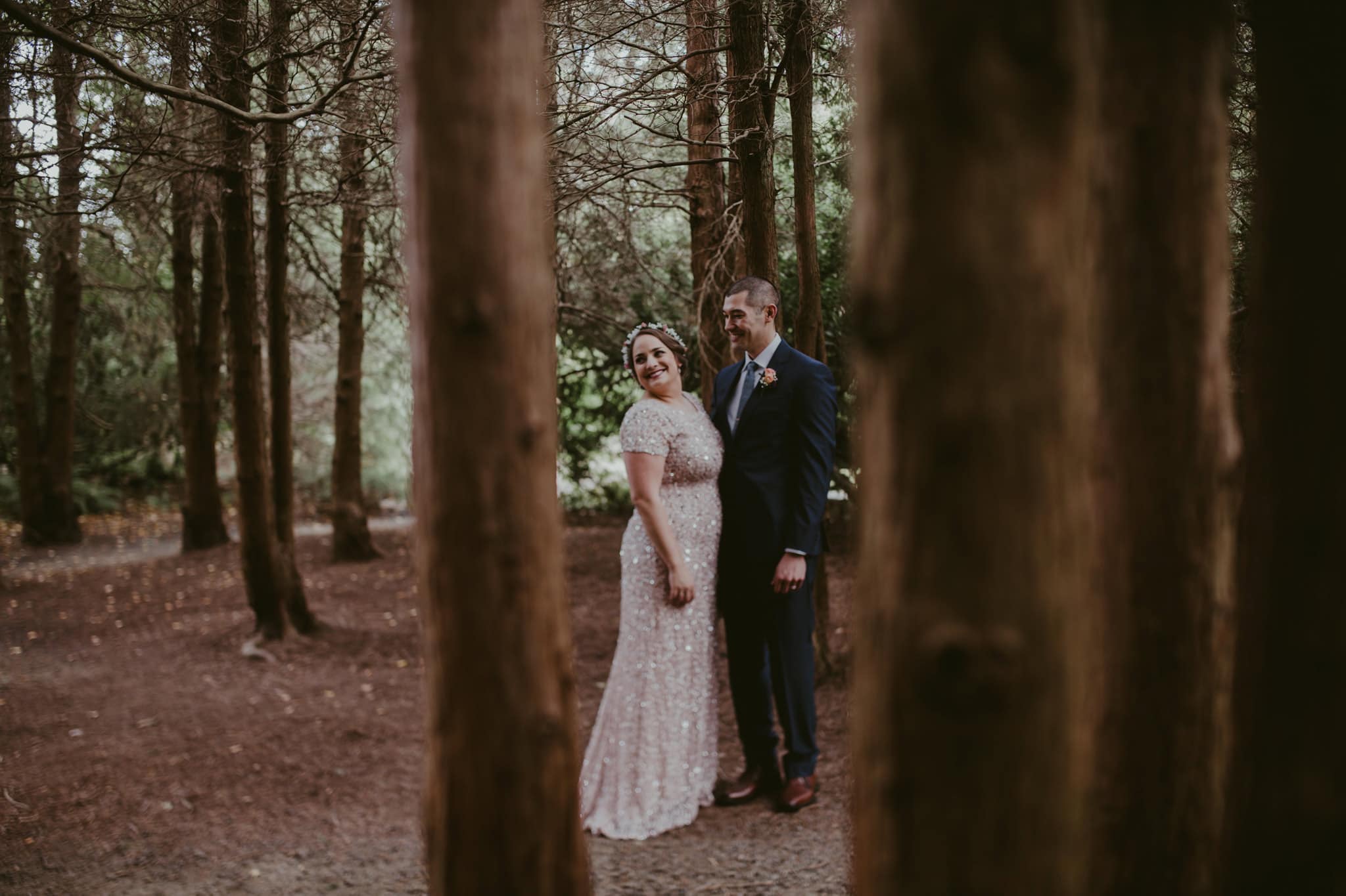 bride and groom in trees Kubota Garden Wedding by Marcela Pulido Photography Portland Wedding Photographer