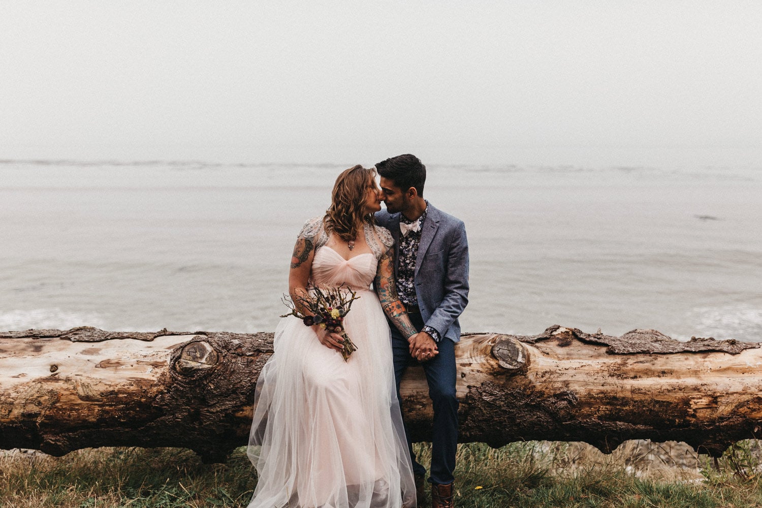 cute interracial tattooed couple with pink wedding dress olympic peninsula elopement by marcela pulido portland oregon wedding and elopement photographer