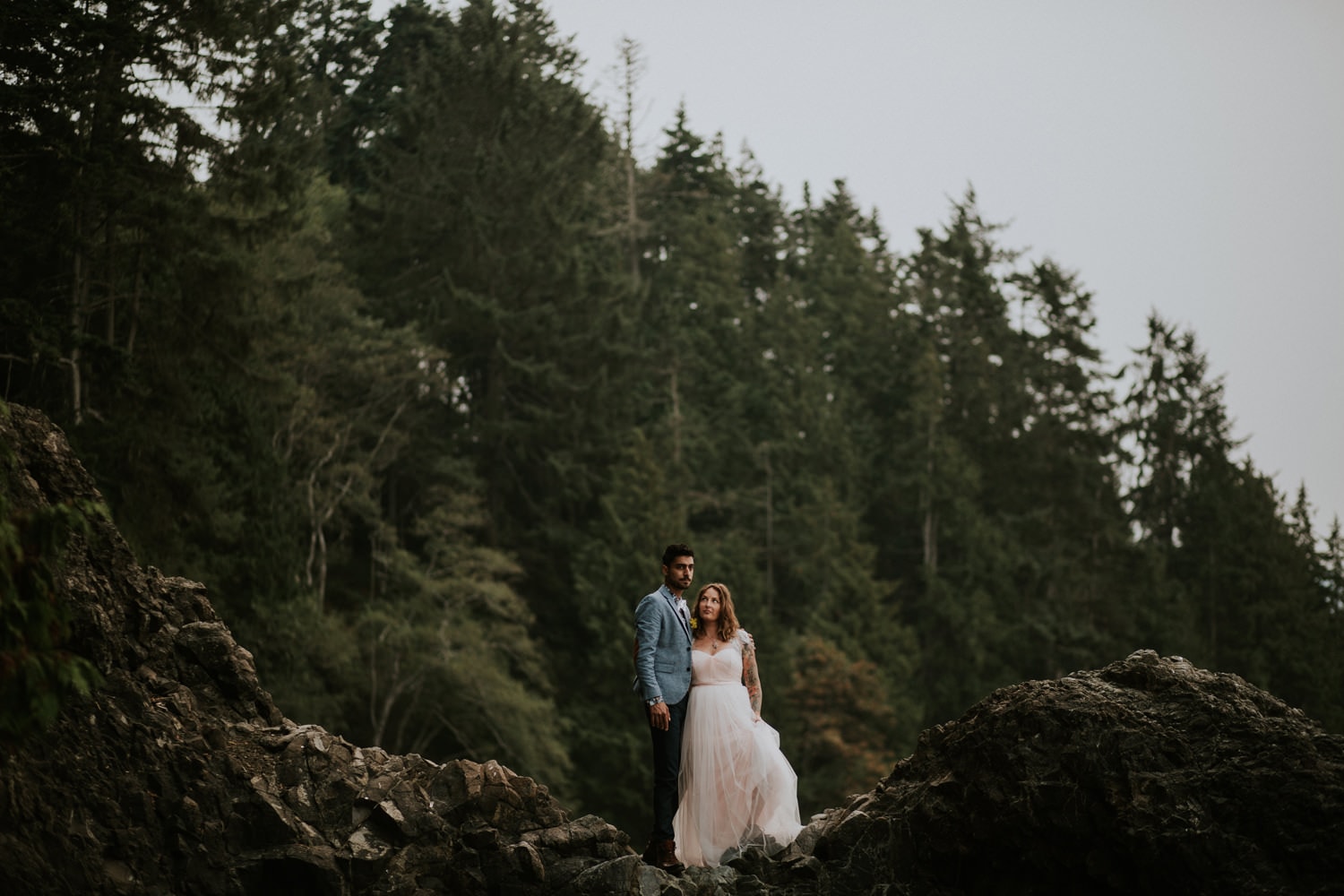 newlywed couple tattoo pink wedding dress pacific northwest forest trees olympic peninsula elopement by marcela pulido portland oregon wedding and elopement photographer