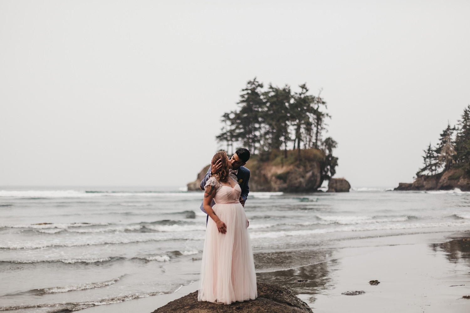pink wedding dress newlywed couple kissing on the olympic peninsula elopement by marcela pulido portland oregon wedding and elopement photographer