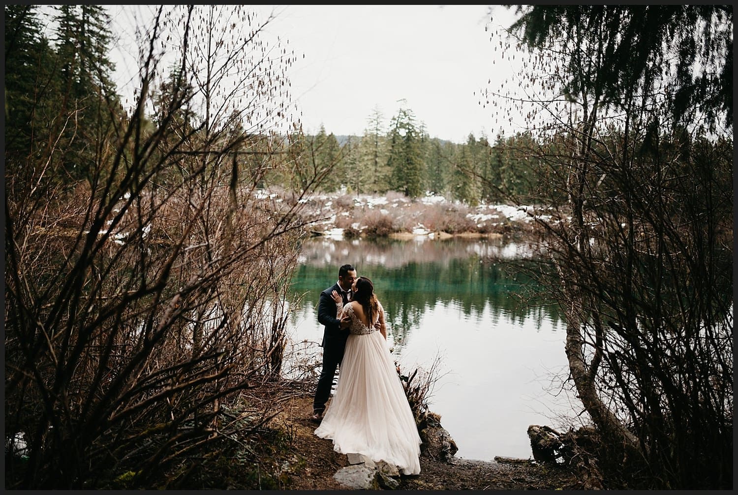 couple kissing in the forest near Clear Lake at McKenzie River wedding