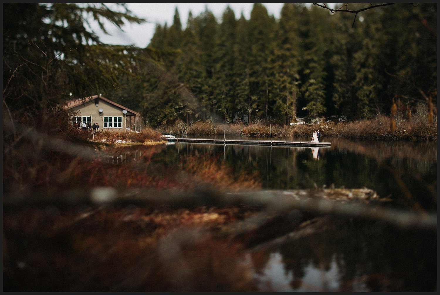 beautiful couple reflection in lake for their wedding Mckenzie river wedding at Clear lake
