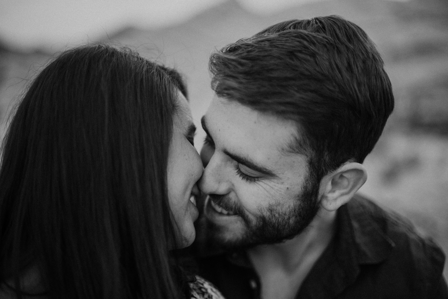 black and white close up and intimate shot of beautiful couple at mormon rocks in the san bernardino mountains