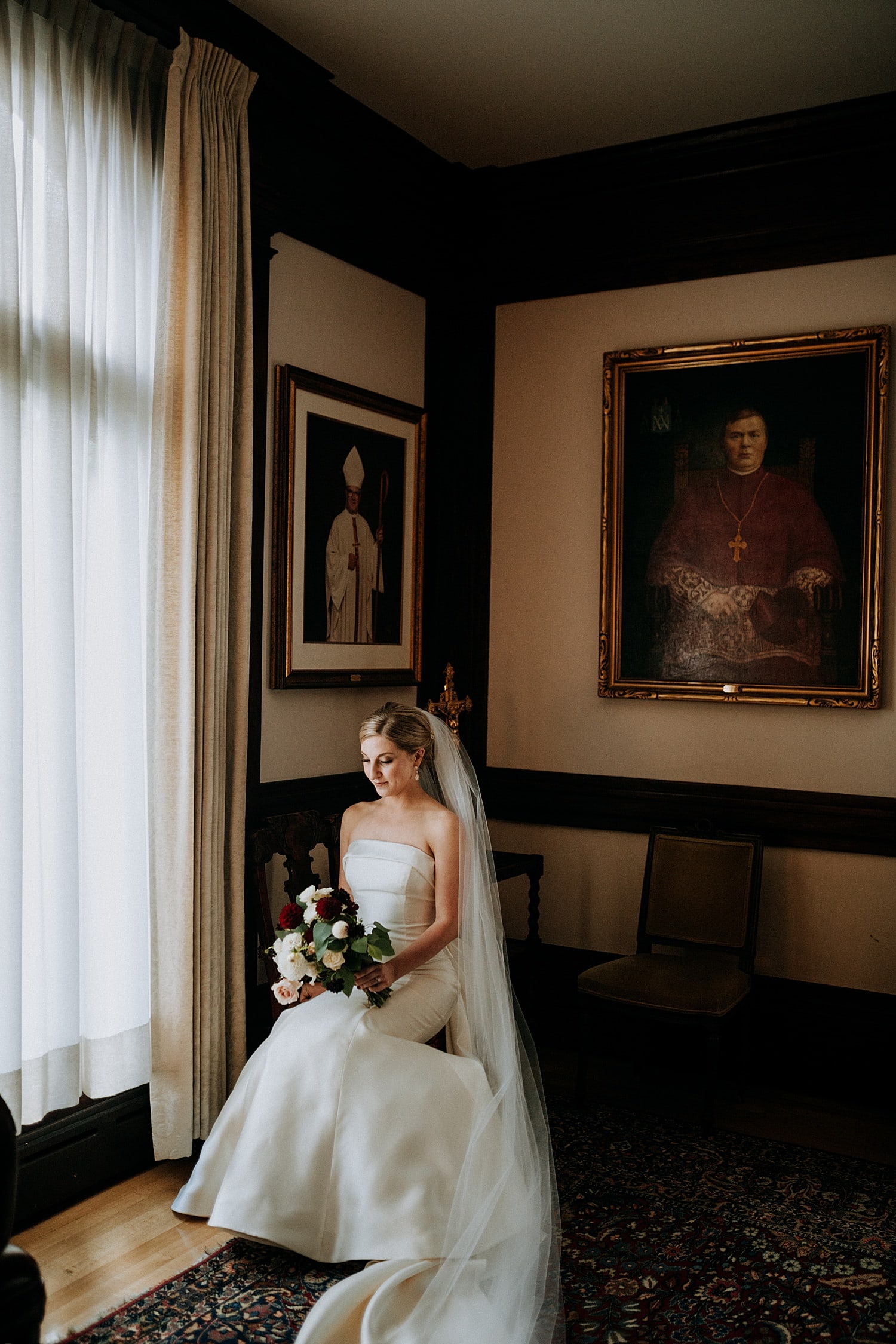 dark and moody portrait of the bride before her ceremony at St James Cathedral