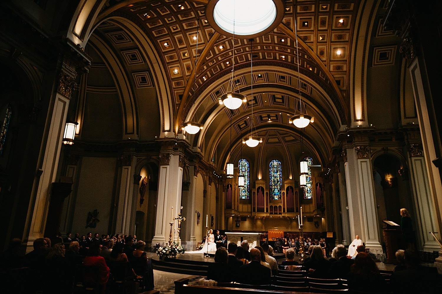 wide view of st james cathedral during a catholic wedding ceremony 415 Westlake Wedding by Marcela Pulido Seattle Wedding Photographer