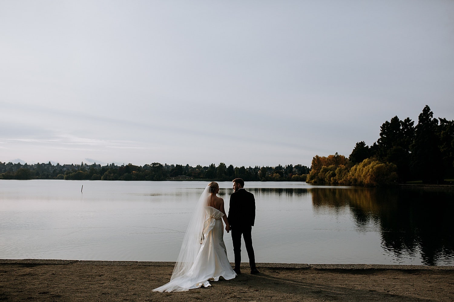 portrait of the bride and groom staring at each other at Green Lake 415 Westlake Wedding by Seattle Wedding Photographer Marcela Pulido