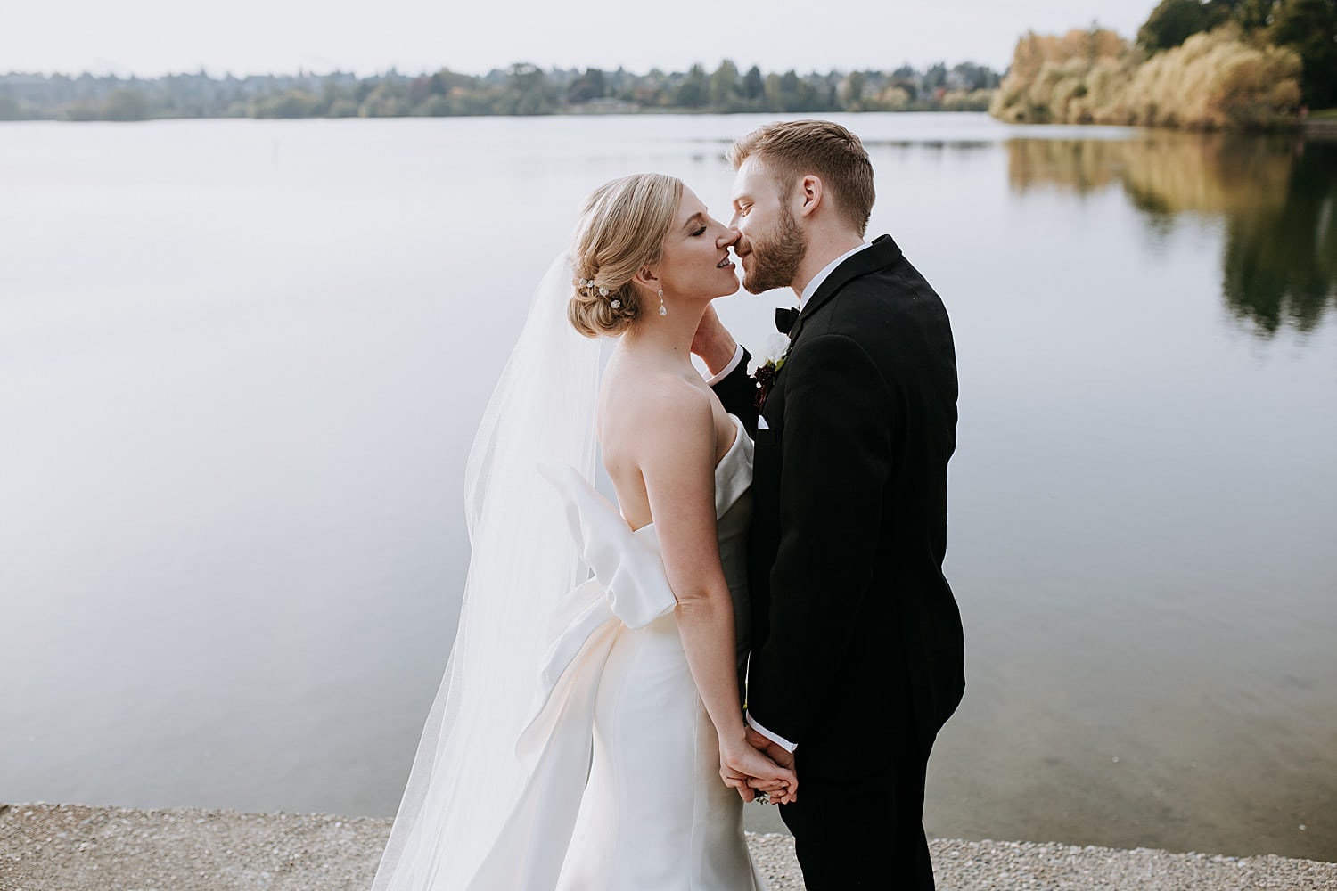 bride and groom kissing at Green Lake 415 Westlake Wedding by Seattle Wedding Photographer Marcela Pulido