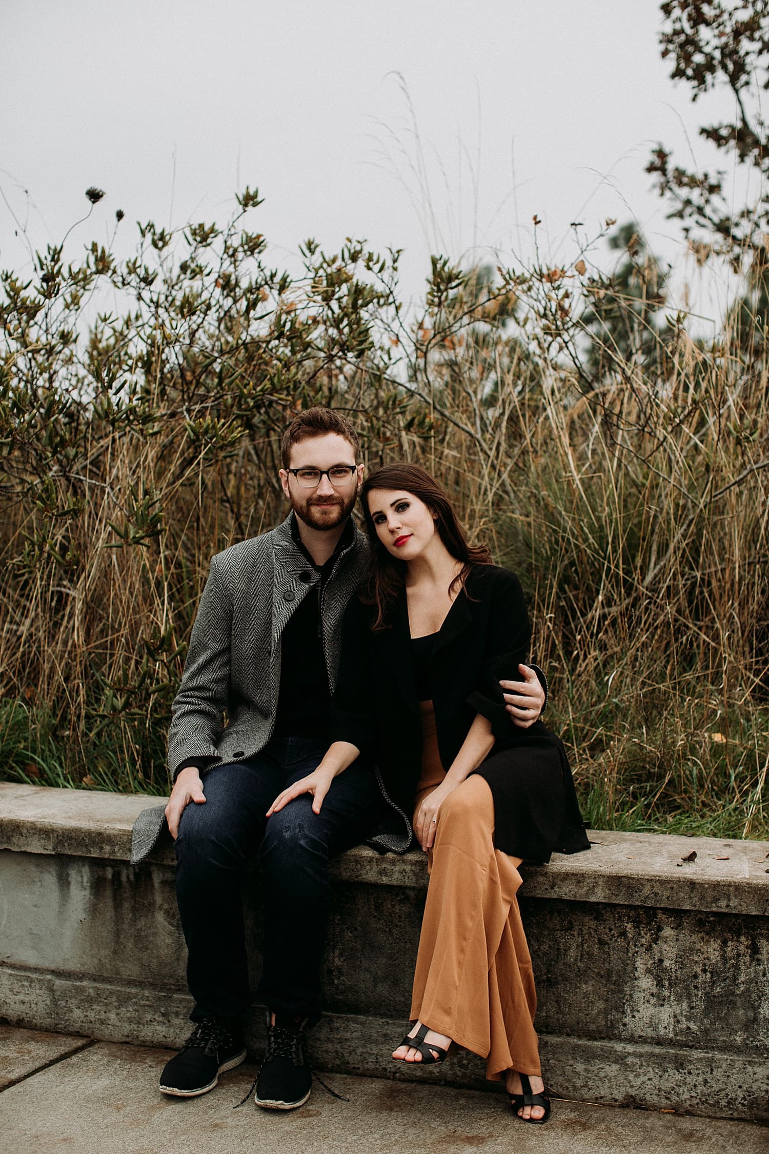 cute couple sitting together Cooper Mountain Engagement session by Portland engagement photographer Marcela Pulido