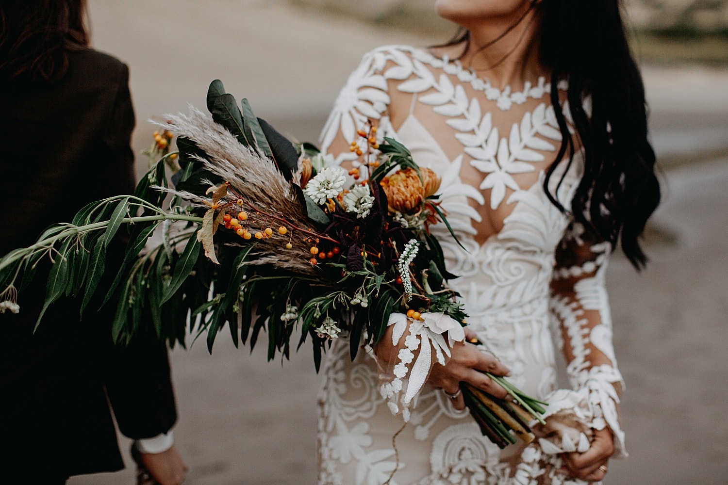 detail shots of rue de seine wedding dress and bouquet on the oregon coast cape kiwanda elopement by marcela pulido portland oregon wedding photography