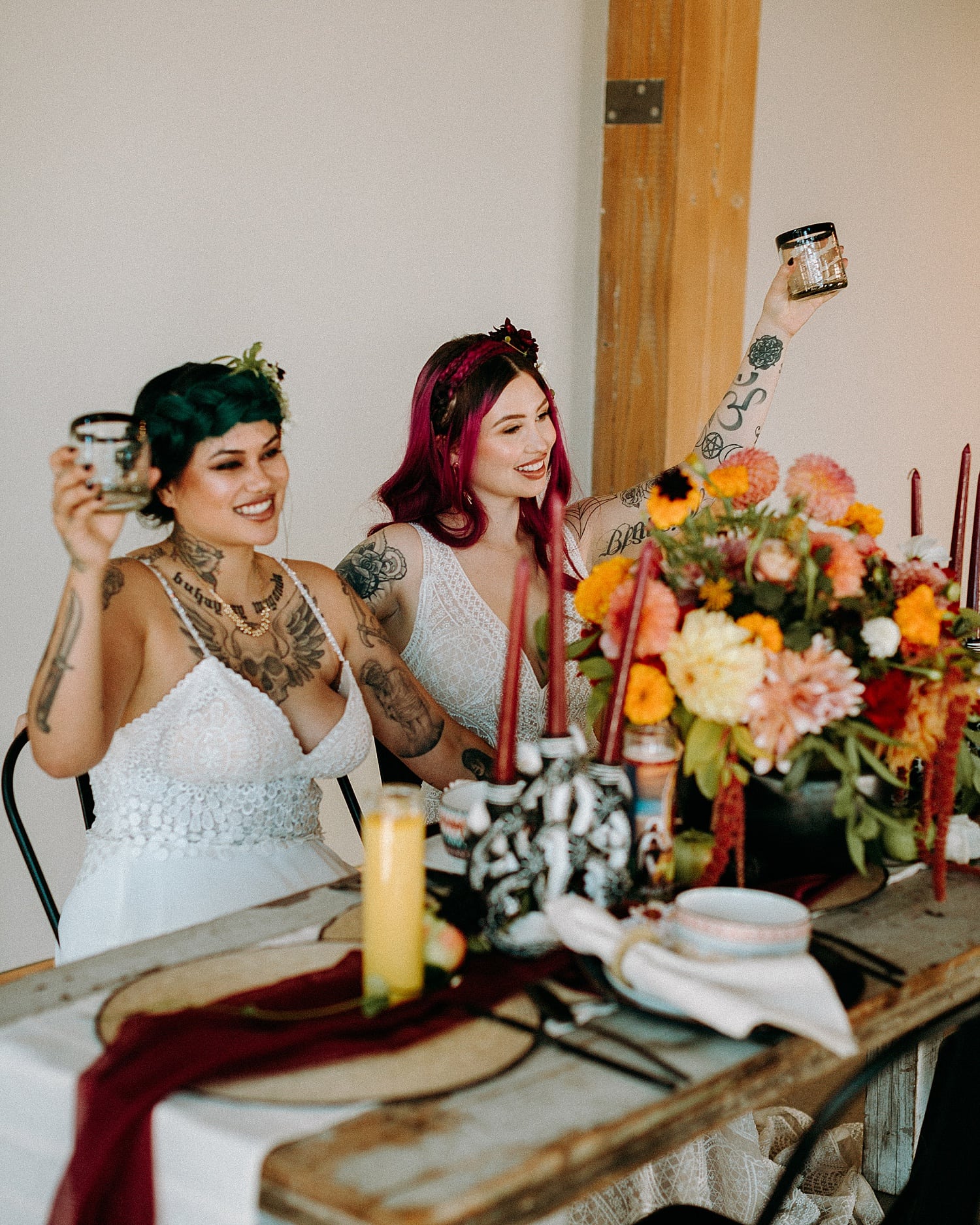 beautiful and edgy same sex lesbian couple cheers and toast on their wedding day mexican wedding photographed by Marcela Pulido Photographer Portland Wedding Photography