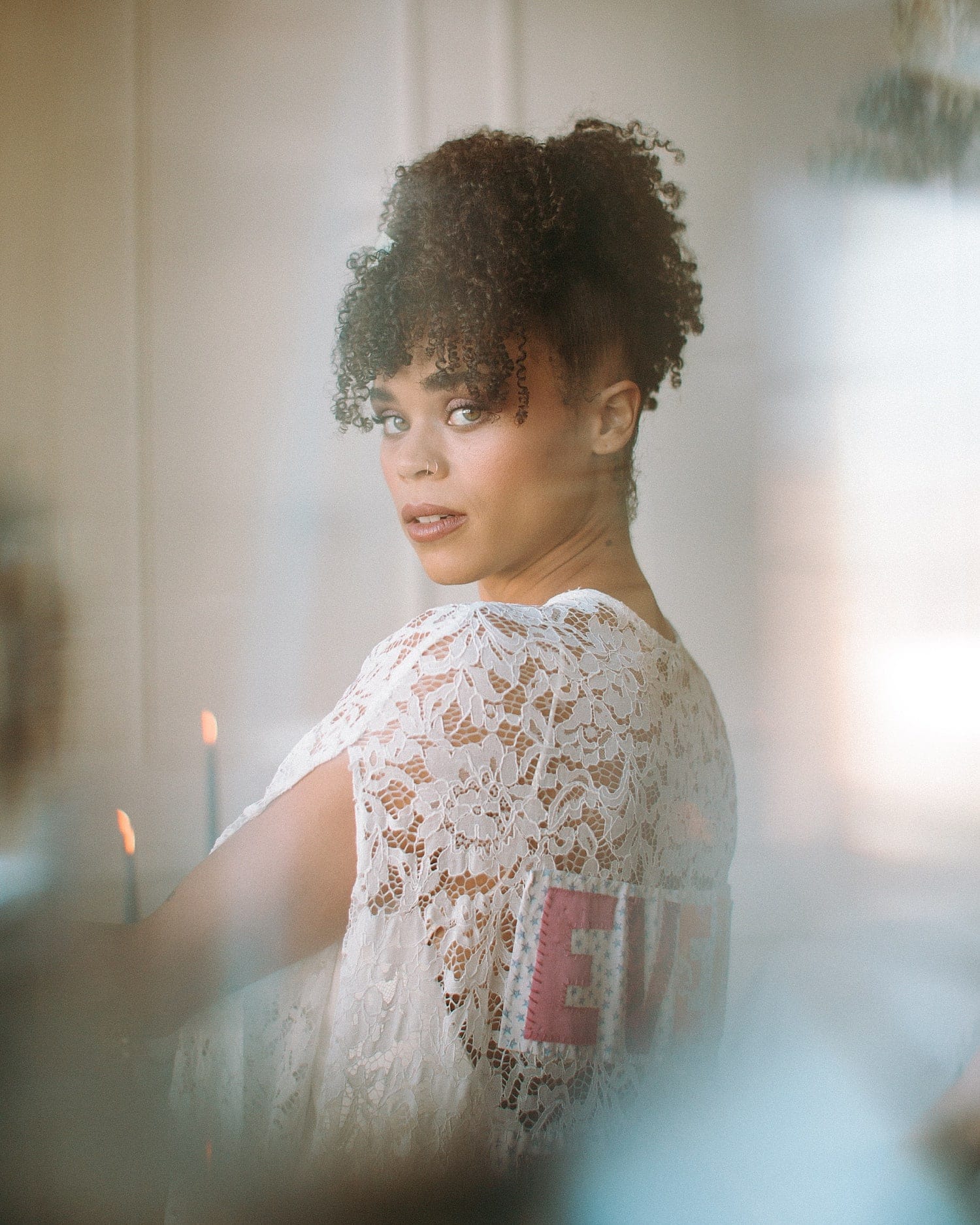 dreamy and ethereal portrait of a black bride with hazel eyes and curly hair wearing a lace cape by Claire La Faye portland wedding photography pricing by marcela pulido