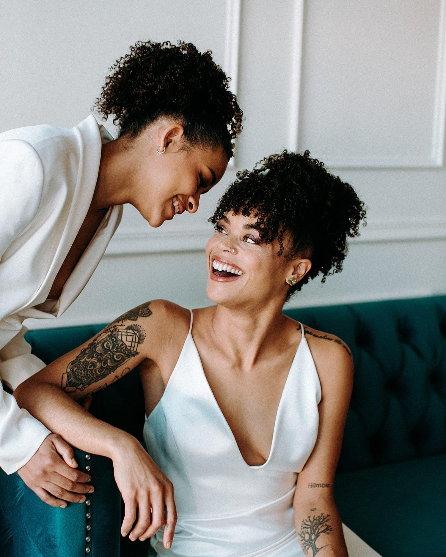beautiful same sex lesbian lgbtq+ friendly wedding couple newlywed wearing all white gown and all white feminine suit portland wedding photography pricing by marcela pulido portland wedding photographer