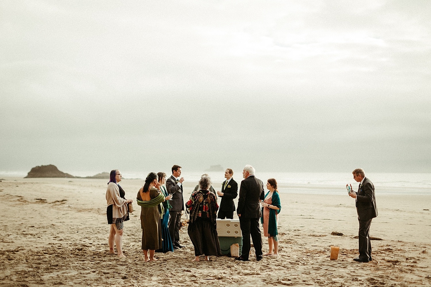 intimate family cocktail hour reception on the coast hug point elopement captured by marcela pulido photography portland oregon wedding elopement photographer