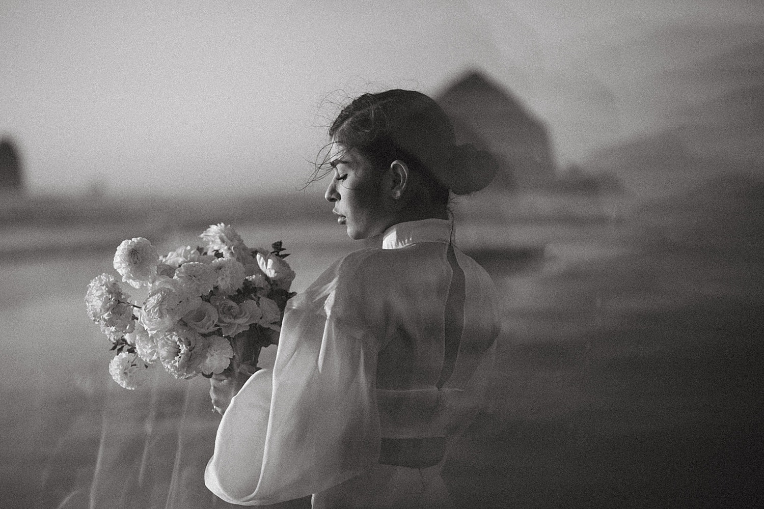 black and white portrait of stunning latina bride at cannon beach captured by marcela pulido portland oregon wedding photographer