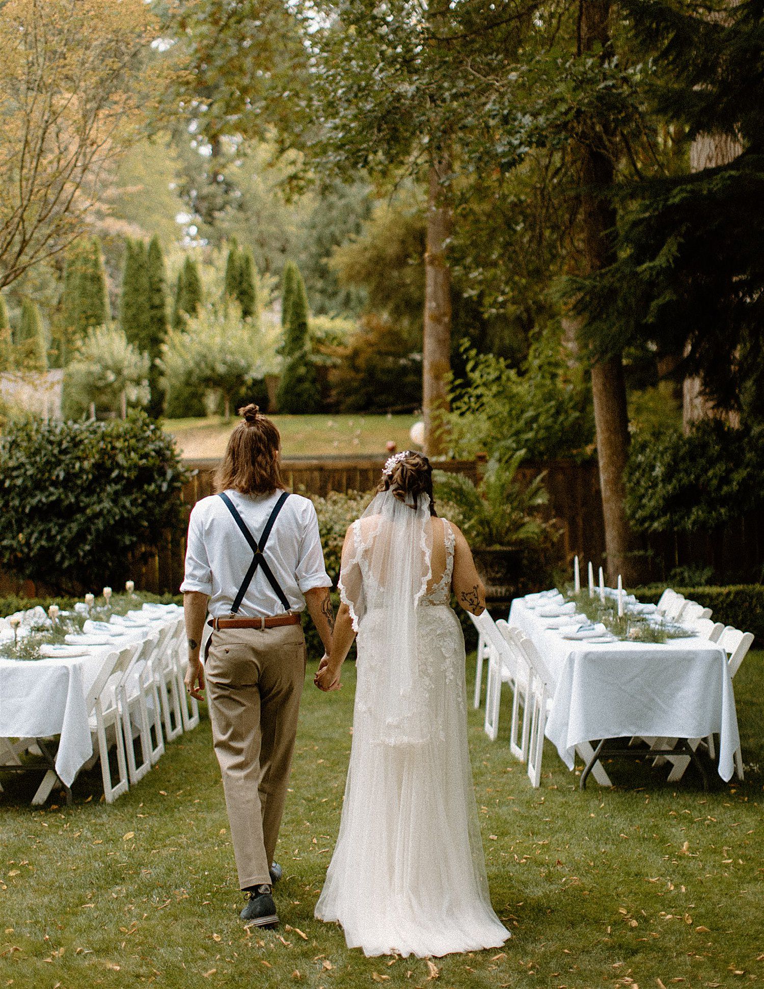 bride and groom checking out their reception site for this french country cottage wedding