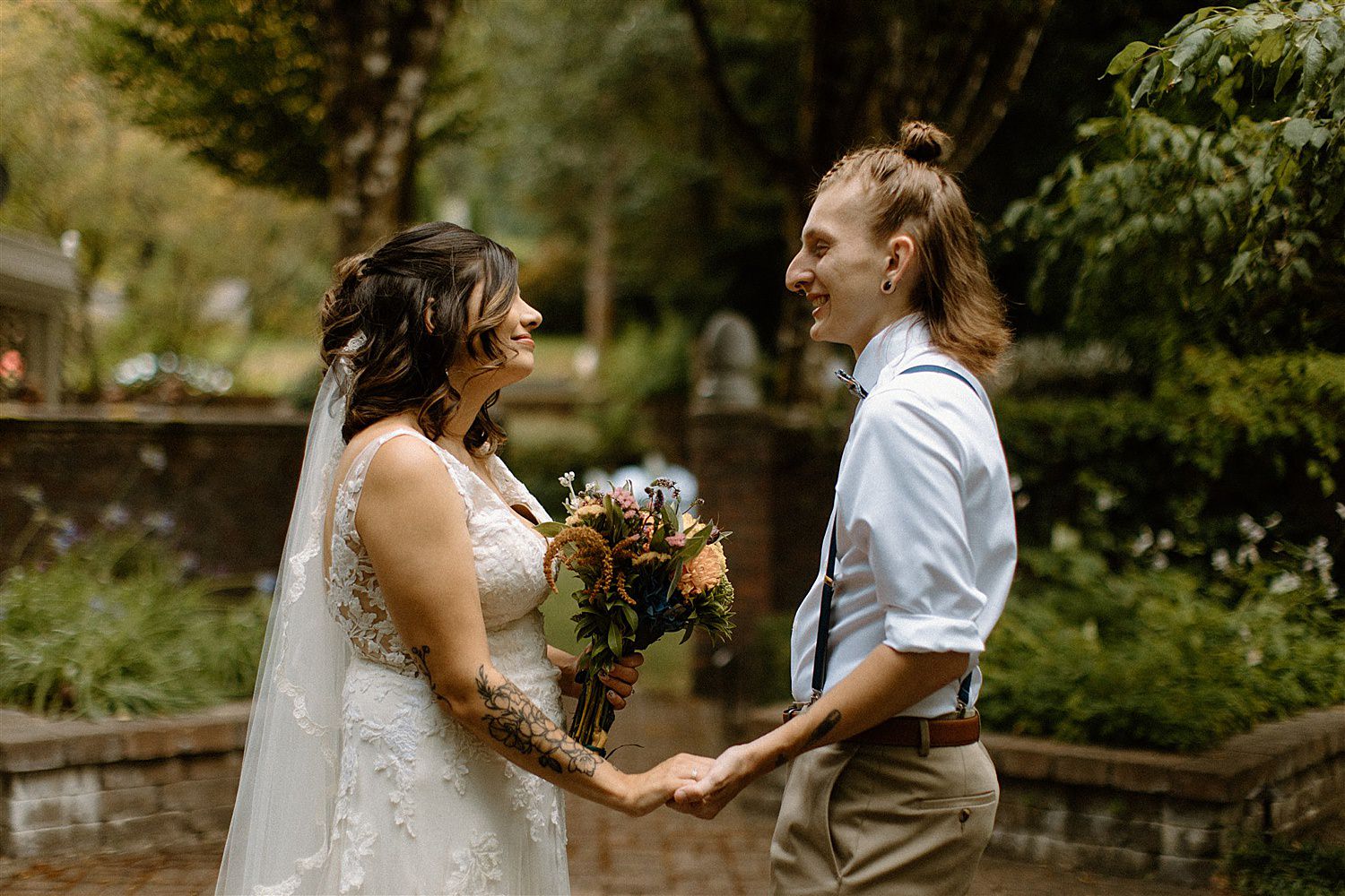 bride and groom holding hands in love at this french country cottage wedding in lakewood washington